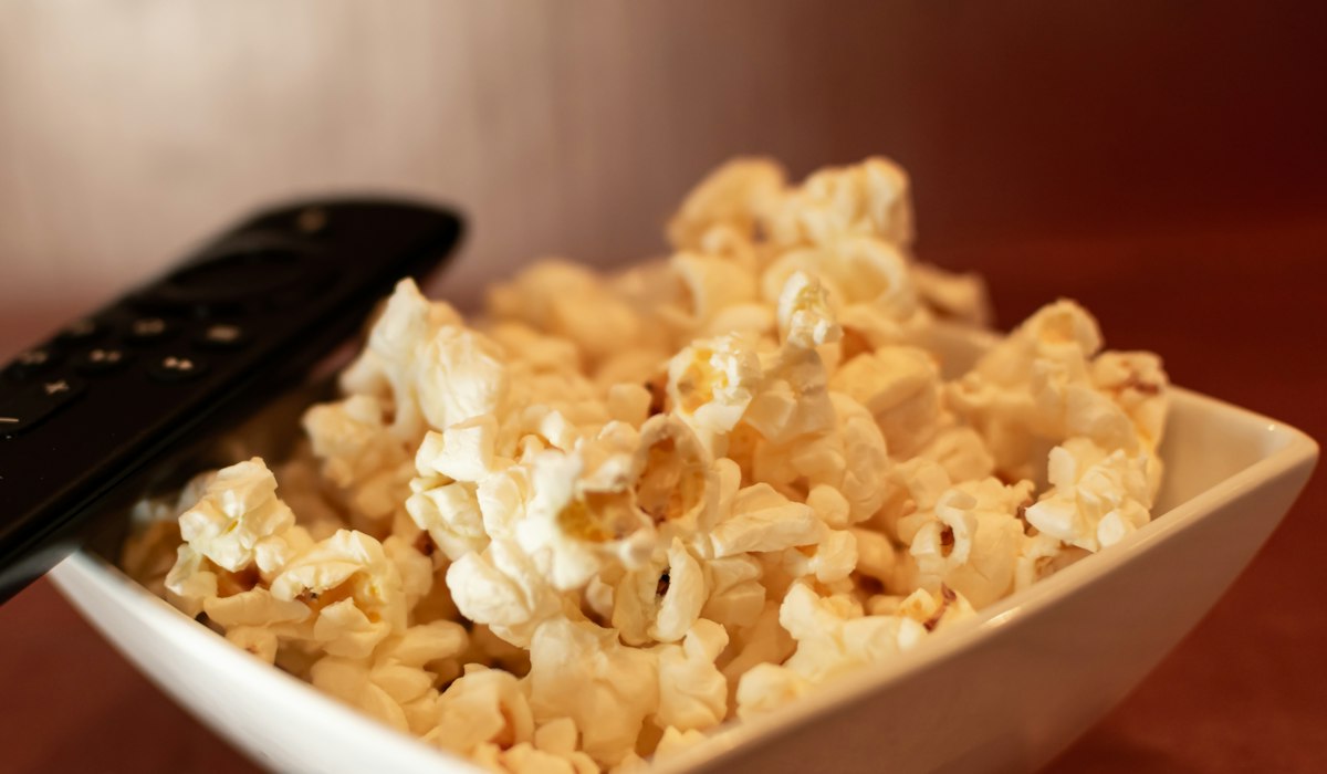 Popcorn and remote for Thanksgiving commercial break games