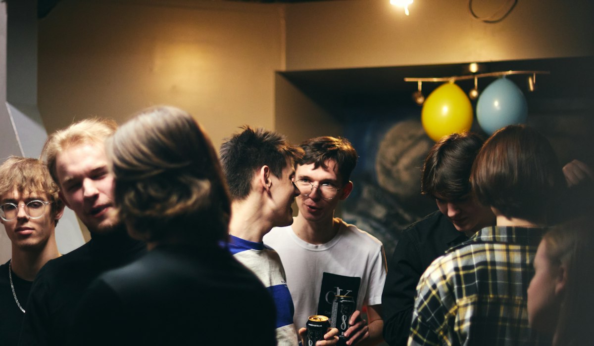 Guests mingling at a Thanksgiving whole room mixer game
