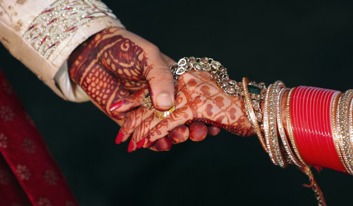 Role play ideas for married couples holding hands with wedding rings
