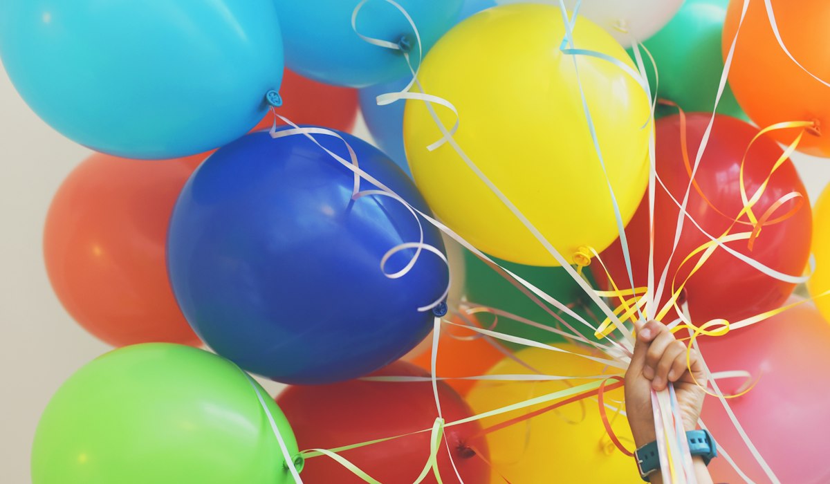 Party game stations with balloons for large Thanksgiving groups